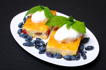 Appetizing cottage cheese casserole with berries and sour cream