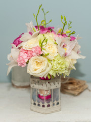 Beautiful flower bouquet with colorful roses on the table