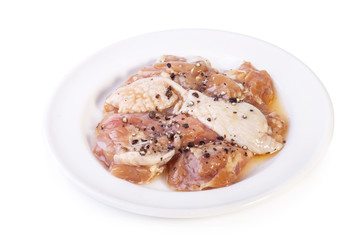 raw marinated chicken with black pepper