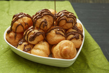 Tasty Pastries with Chocolate Syrup on Plate