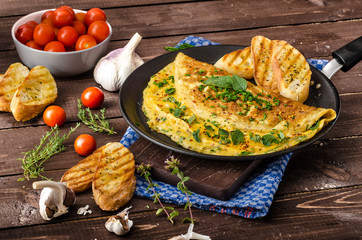 Herb omelette with chives and oregano sprinkled with Herb omelette with chili flakes