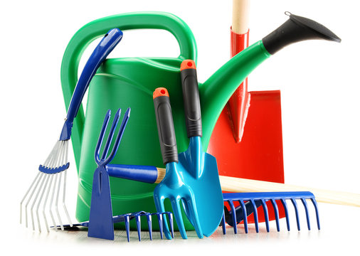 Watering Can And Garden Tools Isolated On White