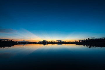 Sunset landscape with blue sky at the calm lake