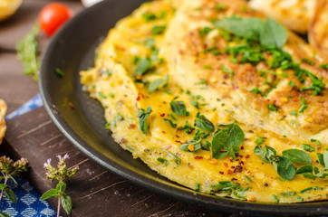 Herb omelette with chives and oregano sprinkled with Herb omelette with chili flakes