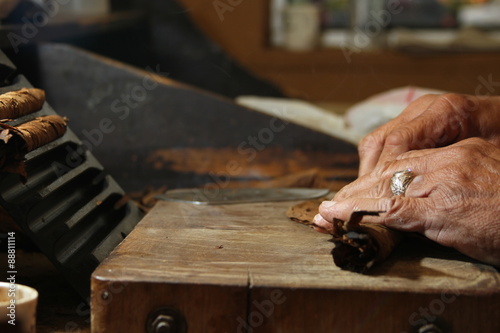 “Cuban cigars roller in his table” Stock photo and royalty-free images