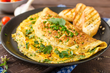 Herb omelette with chives and oregano sprinkled with Herb omelette with chili flakes - 88811376
