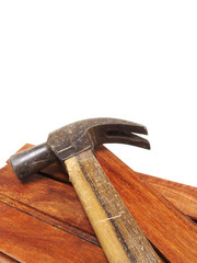 Wood planks with hammer isolated on white background
