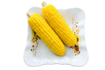 Boiled corn on a plate.