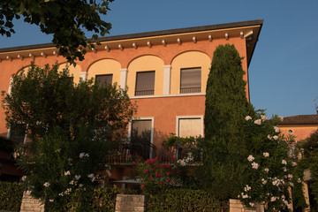 Fototapeta na wymiar italian house in Torri del Benaco in the sunset