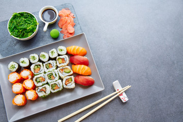 Fototapeta na wymiar Sushi Maki and Niguiri soy sauce and wasabi