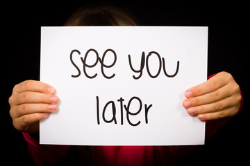 Child holding See You Later sign