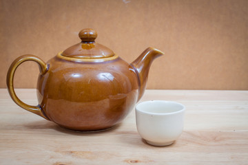 kettle on wooden table,vintage style