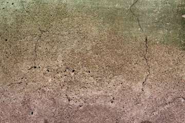 An old, concrete wall with cracks