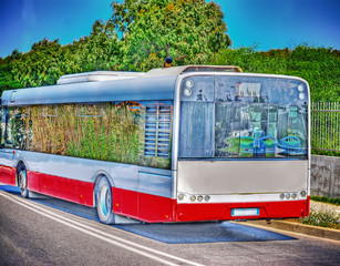 side view of a bus in  hdr tone