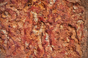 Texture of cracked red clay walls