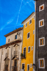 Fototapeta na wymiar Old color houses facades in Cuenca, central Spain