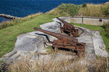 Copenhagen, Denmark - August 9, 2015: Rusty cannons at Trekroner fort which is located at the entrance of Copenhagen harbour.