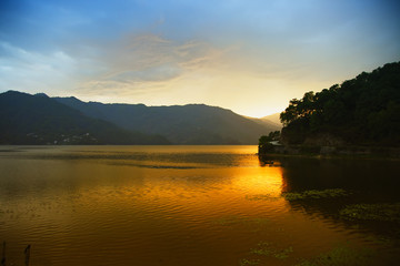 Evening landscape with lake and mountains