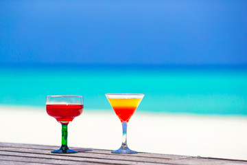 Two tasty cocktails on tropical white beach