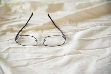 Modern Glasses on white bed