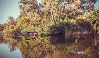 Mystical island. The reflection in the calm water