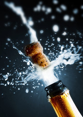 Close up of champagne cork popping