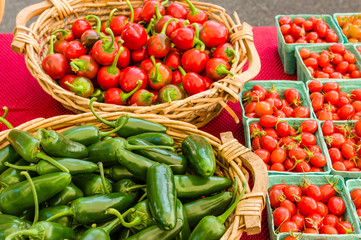 Baskets of peppers and tomatoes