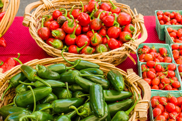 Baskets of peppers and tomatoes