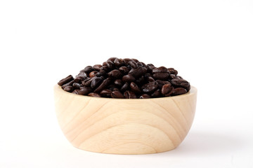 Coffee beans in wooden bowl isolated on white background