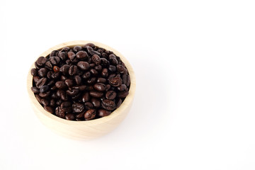 Coffee beans in wooden bowl isolated on white background