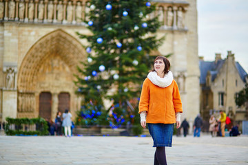 Happy young tourist in Paris on a winter day,