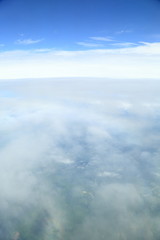Rainbow which suits cloud roundly. Japan seen from the sky.