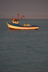 Fishing boat and sunset in Mancora, Peru