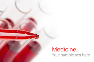 Pipette with drop of blood
