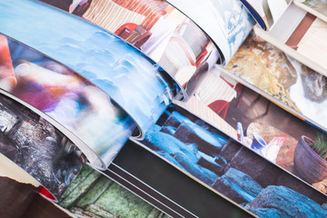 stack of open colorful magazines. information