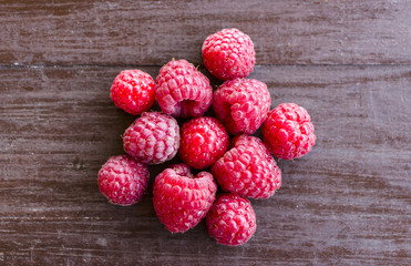 Fresh raspberries on a wooden table