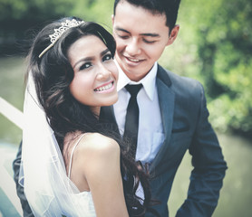 beautiful bride and handsome groom smiling