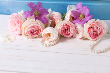 Pastel pink roses, clematis flowers