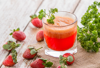 a glass of fresh strawberry juice