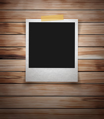 Photo frame stick on vintage wooden texture. Vector illustration