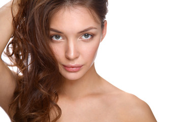 Fototapeta premium Close up portrait of beautiful young woman face. Isolated on