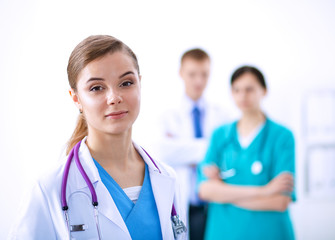 Fototapeta premium Woman doctor standing with stethoscope at hospital