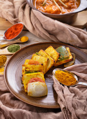 indian paneer tikka served with chicken tikka masala
