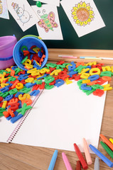 Fototapeta premium Letters of alphabet on school desk