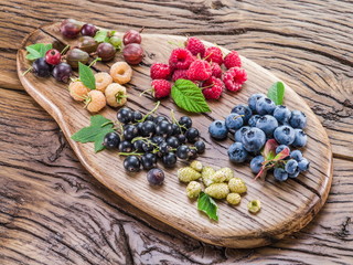 Ripe berries on the old wooden plank.