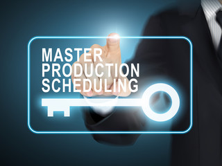 male hand pressing master production scheduling key button