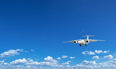 Fototapeta na wymiar Airplane in the blue sky.