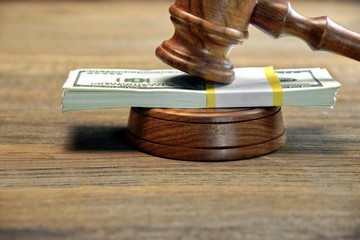 Judges Gavel, Soundboard And Bundle Of Money On The Table