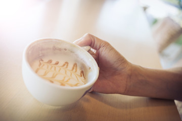 woman hand holding coffee cup caramel macchiato