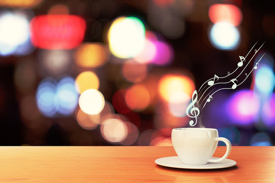 cup of coffee on a wooden table in a cafe and musical notes, con